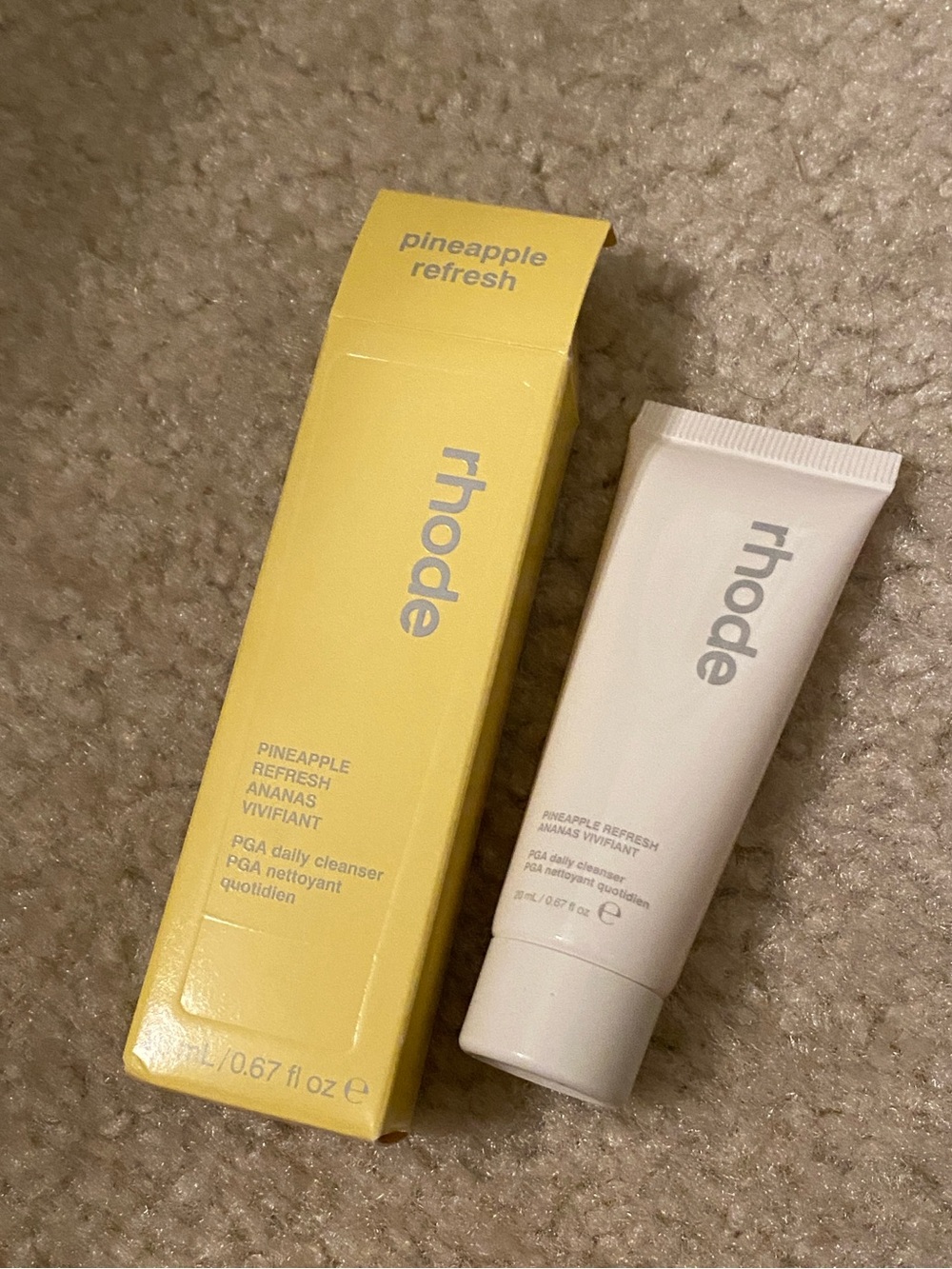 travel-size bottle of Rhode Pineapple Refresh PGA Daily Cleanser